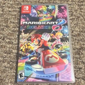 3 Used Nintendo switch games which is Mariokart delux, Arms, and Legend of Zelda
